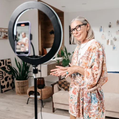 older woman recording a video at home