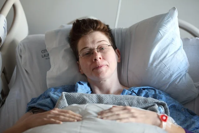 patient lying on bed in hospital