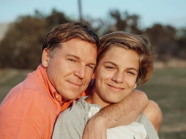 Father and Son Posing Together