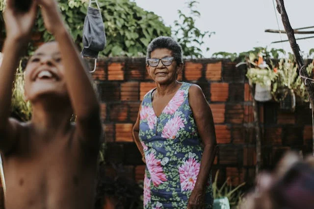 Grandmother Watching Her Grandson Play